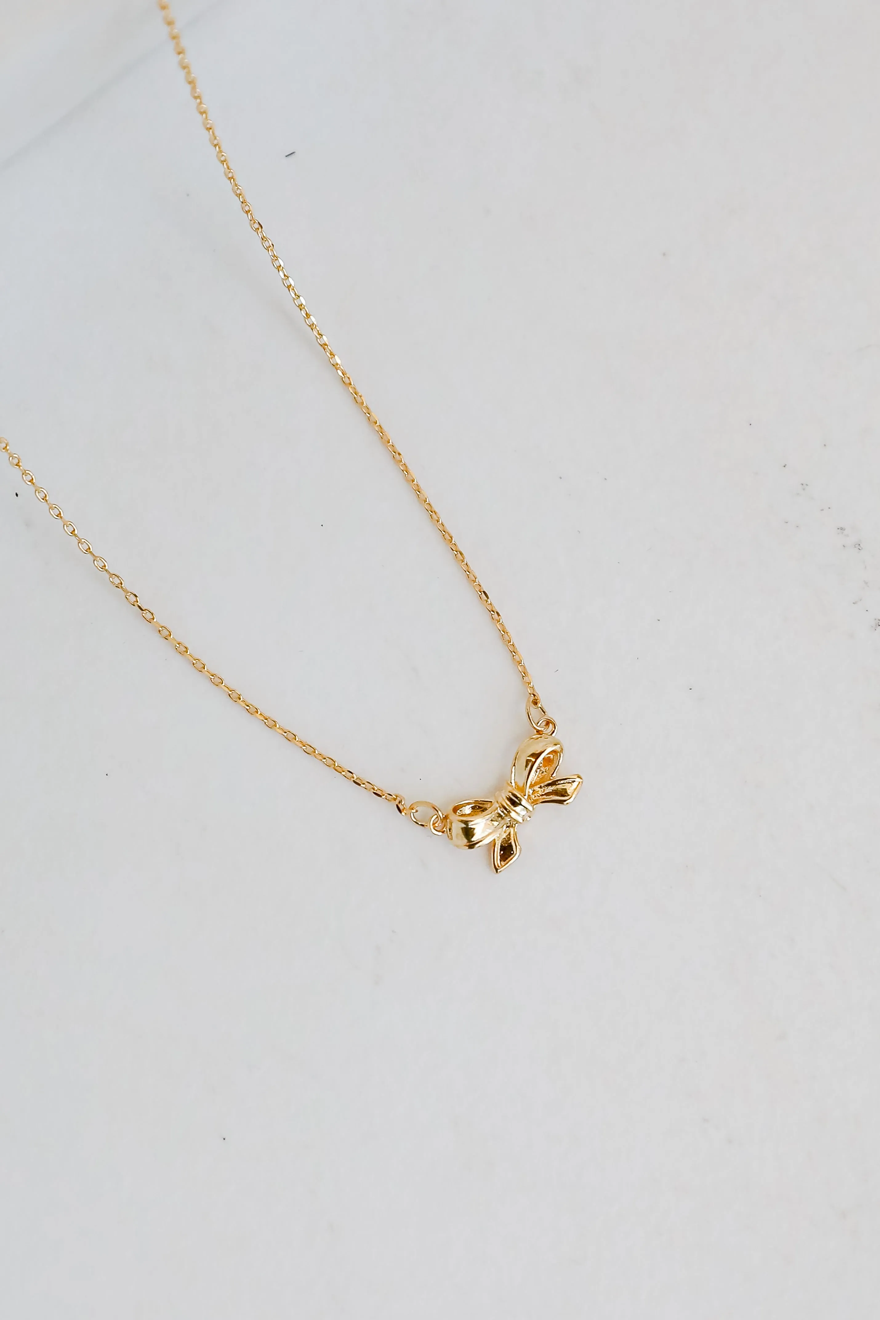 Brooke Gold Bow Charm Necklace